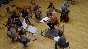 George Benjamin conducting BCMG through Francesco Antonioni's Ballata, with the composer in front of the ensemble George Benjamin conducting BCMG through Francesco Antonioni's Ballata, with the composer in front of the ensemble