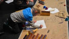 Boy creating graphic score for BCMG musicians at Musicadoodle-do Boy creating graphic score for BCMG musicians at Musicadoodle-do