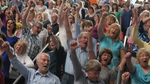 Crowd Out vocalists with their fists raised Crowd Out vocalists with their fists raised