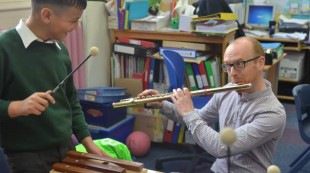 Flautist Anthony Robb at a Big Ears workshop with school pupil Flautist Anthony Robb at a Big Ears workshop with school pupil