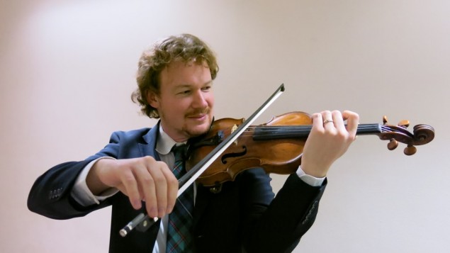 Gabriel Dyker playing his violin Gabriel Dyker playing his violin