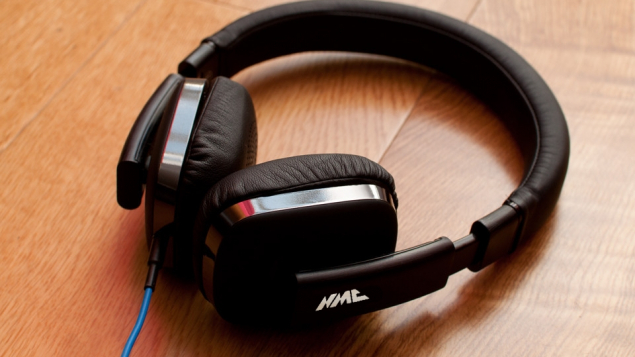 Headphones on table with NMC logo Headphones on table with NMC logo